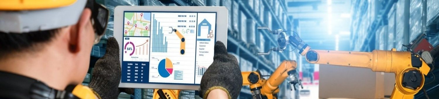 A man using a tablet while working in a warehouse