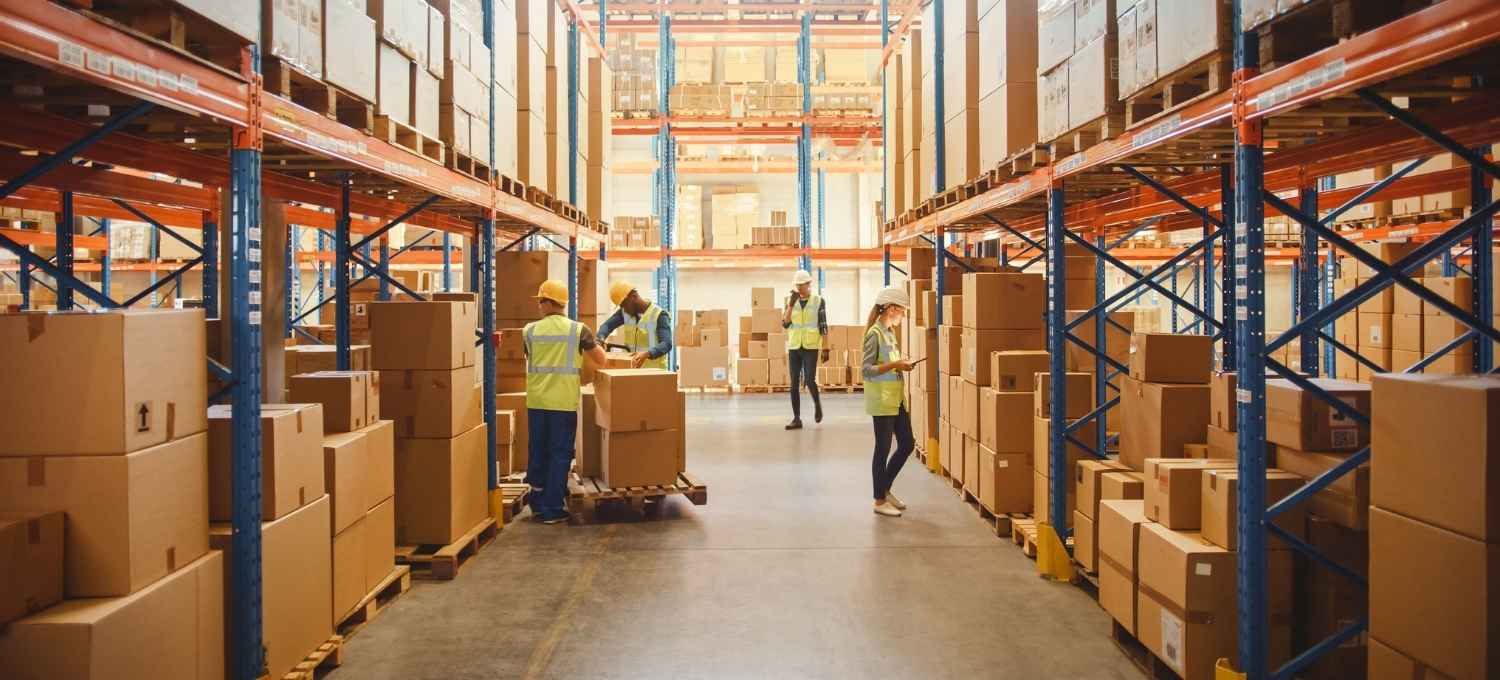 People moving items in a warehouse